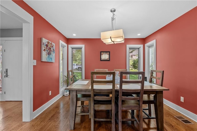 3610 NE Basswood Dr, Lees Summit, MO 64064 - dining room with plenty of natural light, baseboards, wood finished floors, and recessed lighting