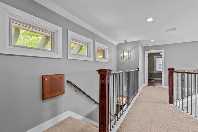 3610 NE Basswood Dr, Lees Summit, MO 64064 - hall with an upstairs landing, a chandelier, baseboards, and recessed lighting
