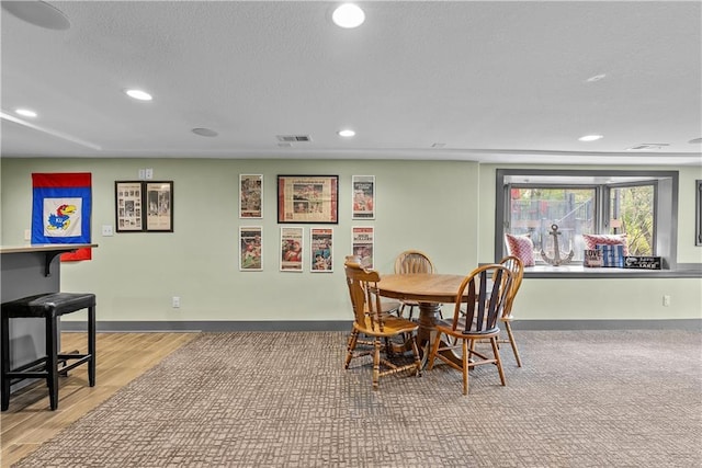 3610 NE Basswood Dr, Lees Summit, MO 64064 - dining area featuring recessed lighting, wood finished floors, baseboards, and a textured ceiling