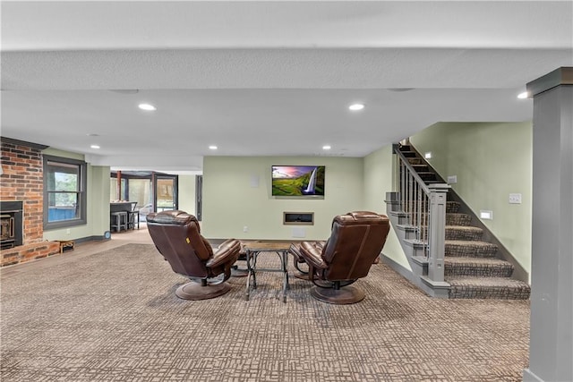 3610 NE Basswood Dr, Lees Summit, MO 64064 - carpeted living area featuring recessed lighting, stairs, a brick fireplace, and baseboards