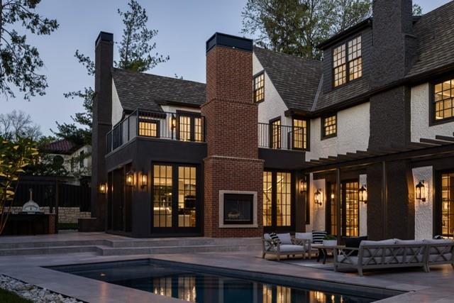 5930 Oakwood Rd, Mission Hills, KS 66208 - rear view of property with a chimney, an outdoor pool, a balcony, a patio area, and an outdoor living space