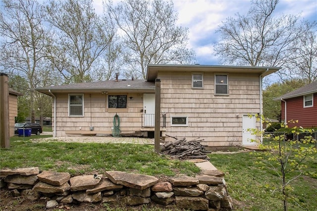 back of property featuring a lawn