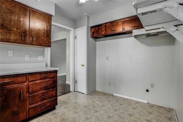 kitchen featuring a ceiling fan and light countertops
