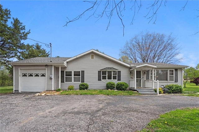 ranch-style home with an attached garage and driveway