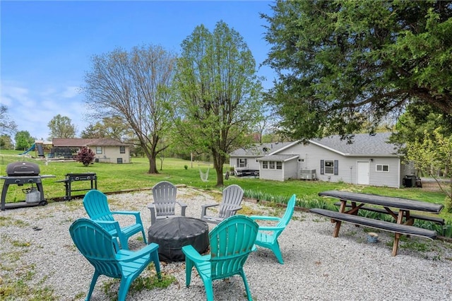 view of patio with an outdoor fire pit and area for grilling