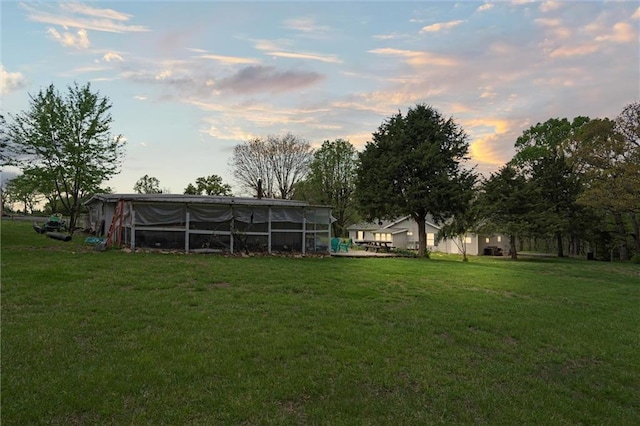 view of yard at dusk