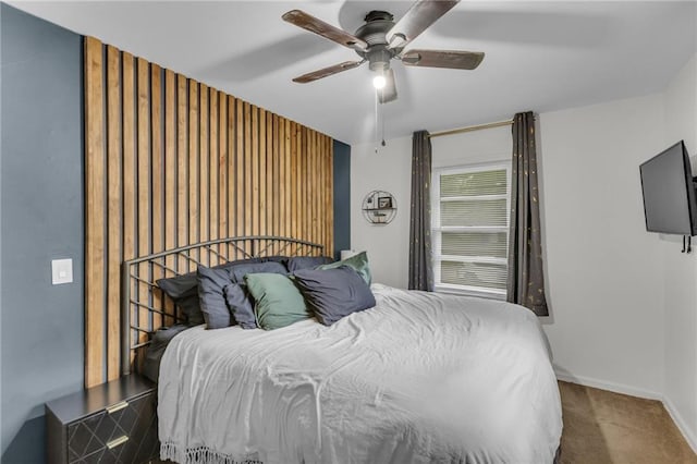 bedroom with carpet floors, baseboards, and ceiling fan