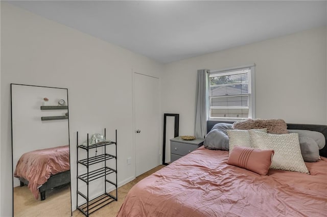 bedroom featuring light carpet