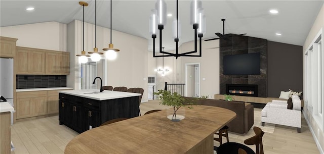 18180 NW 127th St, Platte City, MO 64079 - kitchen featuring light countertops, high vaulted ceiling, a notable chandelier, and a sink