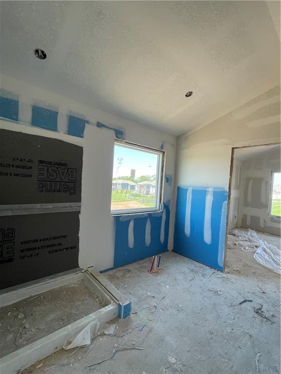 1226 NE 122nd St, Kansas City, MO 64165 - unfurnished room featuring plenty of natural light and a textured ceiling