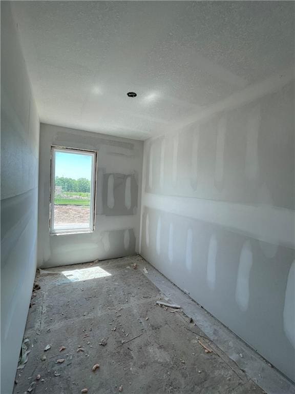 1226 NE 122nd St, Kansas City, MO 64165 - empty room with a textured ceiling