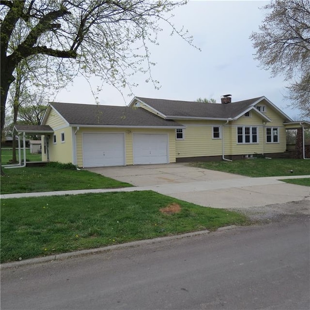 101 E 3rd St, Stanberry, MO 64489 - single story home featuring a chimney, a front lawn, driveway, and an attached garage