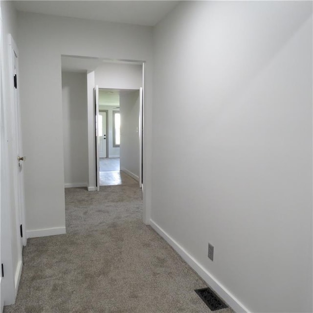 101 E 3rd St, Stanberry, MO 64489 - hall with visible vents, baseboards, and carpet floors