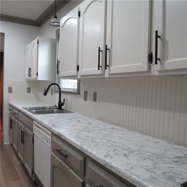 101 E 3rd St, Stanberry, MO 64489 - kitchen featuring a sink, dishwasher, white cabinetry, and dark wood-type flooring