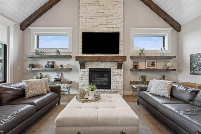 325 Ambersham Dr, Lees Summit, MO 64081 - living area featuring beam ceiling, wood finished floors, a stone fireplace, high vaulted ceiling, and wood ceiling