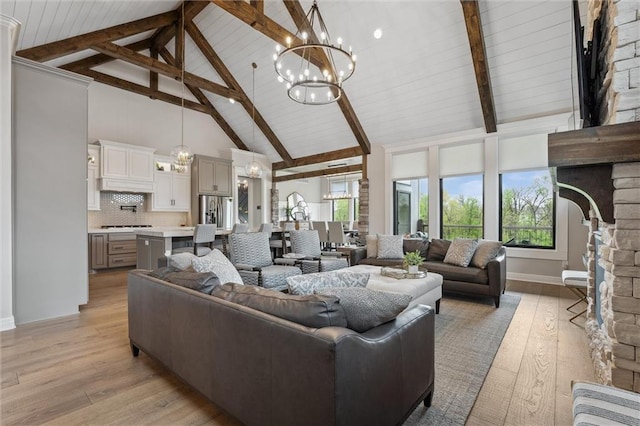 325 Ambersham Dr, Lees Summit, MO 64081 - living room featuring a chandelier, baseboards, high vaulted ceiling, light wood-style floors, and beamed ceiling