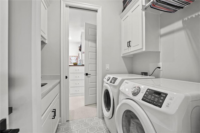 325 Ambersham Dr, Lees Summit, MO 64081 - laundry area with washer and clothes dryer and cabinet space