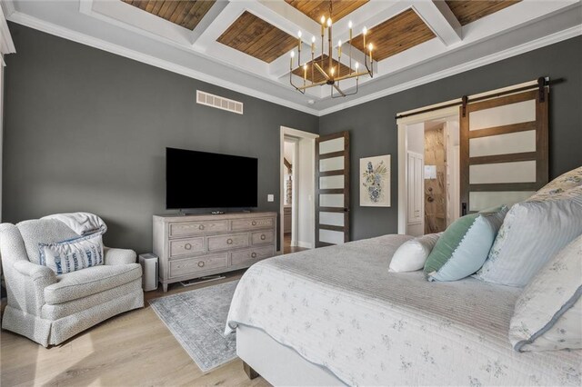 325 Ambersham Dr, Lees Summit, MO 64081 - bedroom featuring a barn door, coffered ceiling, wood finished floors, beamed ceiling, and a chandelier