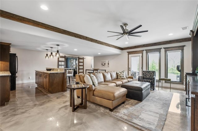 325 Ambersham Dr, Lees Summit, MO 64081 - living room with finished concrete flooring, ceiling fan, baseboards, recessed lighting, and a barn door