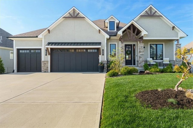 325 Ambersham Dr, Lees Summit, MO 64081 - craftsman-style home with stucco siding, an attached garage, stone siding, and concrete driveway