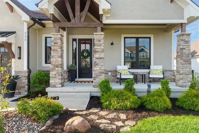 325 Ambersham Dr, Lees Summit, MO 64081 - entrance to property featuring a porch, stucco siding, and stone siding