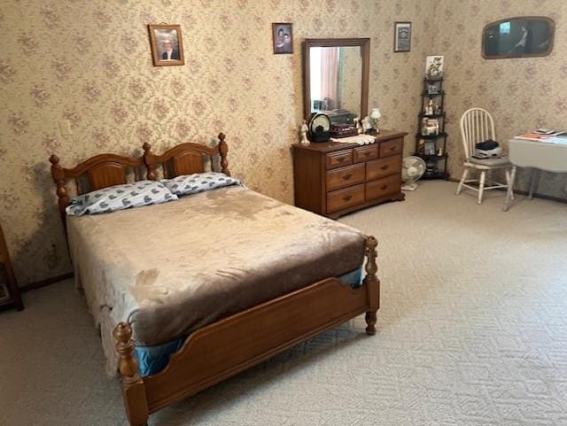 bedroom featuring wallpapered walls and light carpet