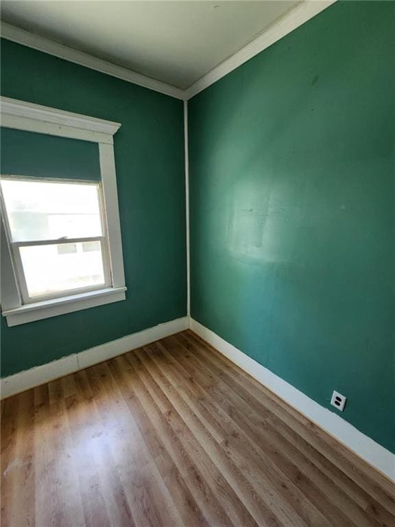 2016 Scott St, Saint Joseph, MO 64507 - empty room with ornamental molding, wood finished floors, and baseboards