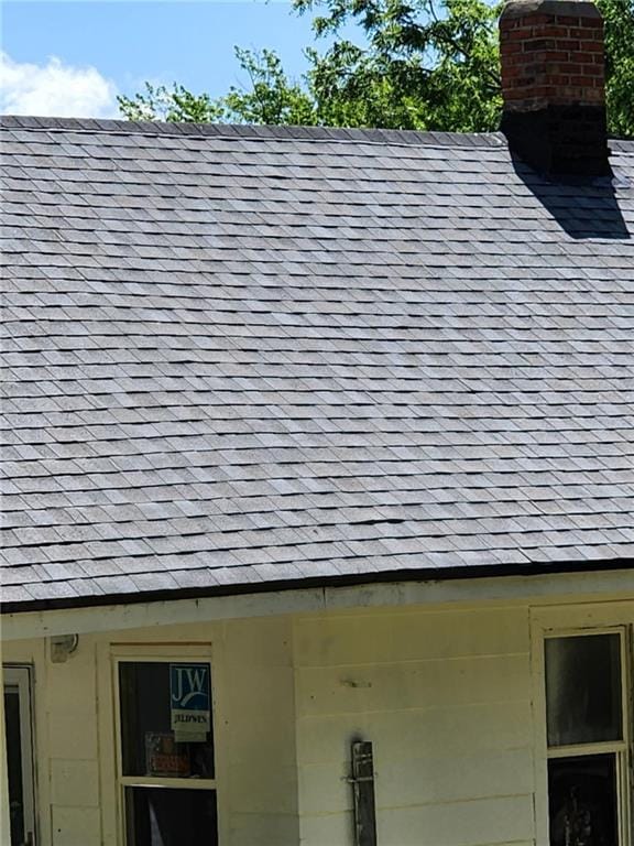 2016 Scott St, Saint Joseph, MO 64507 - exterior view of a chimney and a shingled roof