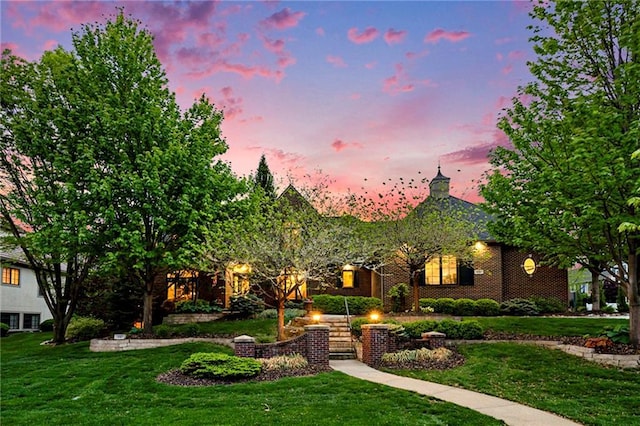 10811 W 140th Ter, Overland Park, KS 66221 - view of front facade with a front lawn and brick siding