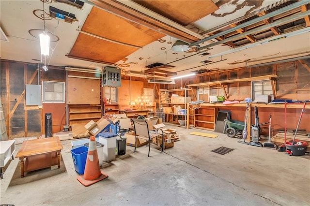 storage featuring electric panel and a garage