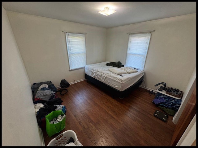 708 Highland Ave, Warrensburg, MO 64093 - bedroom with baseboards and wood finished floors