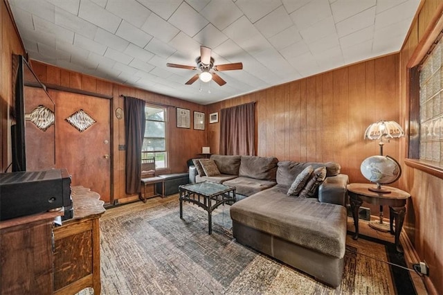 6425 N Edison Ave, Kansas City, MO 64151 - living area with wooden walls and a ceiling fan