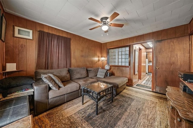 6425 N Edison Ave, Kansas City, MO 64151 - living room with wooden walls and ceiling fan