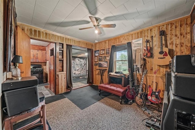 6425 N Edison Ave, Kansas City, MO 64151 - interior space with wooden walls, a ceiling fan, carpet floors, and ornamental molding