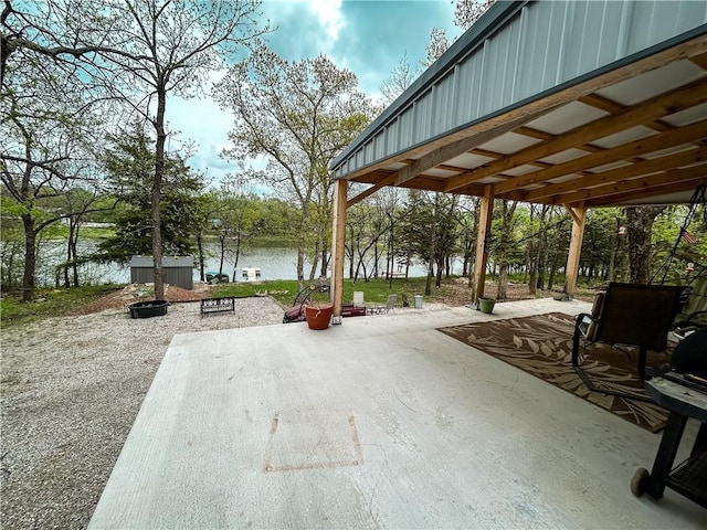 58 E Sugar Lake Cv, Mound City, KS 66056 - view of home's community featuring a patio area and a water view