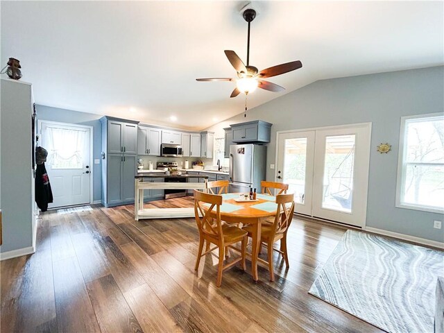 58 E Sugar Lake Cv, Mound City, KS 66056 - dining area with recessed lighting, ceiling fan, baseboards, lofted ceiling, and dark wood finished floors