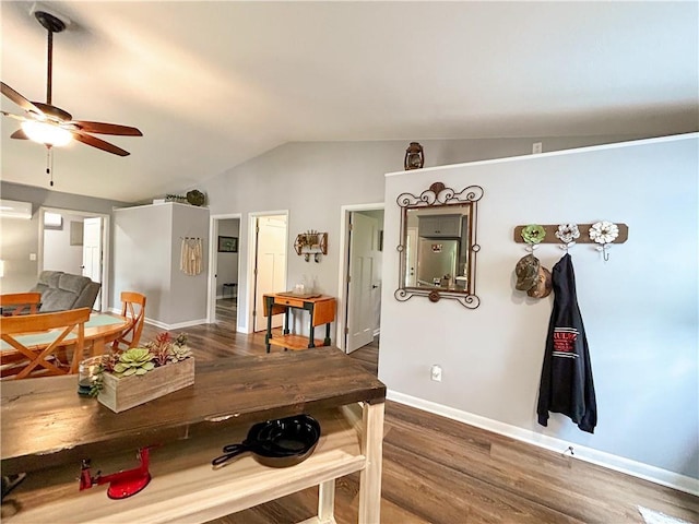 58 E Sugar Lake Cv, Mound City, KS 66056 - dining room featuring baseboards, wood finished floors, ceiling fan, and vaulted ceiling
