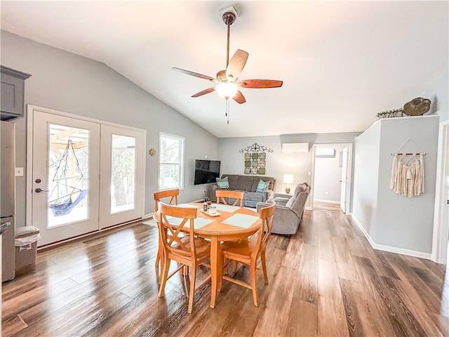 58 E Sugar Lake Cv, Mound City, KS 66056 - dining space featuring wood finished floors, ceiling fan, french doors, and vaulted ceiling