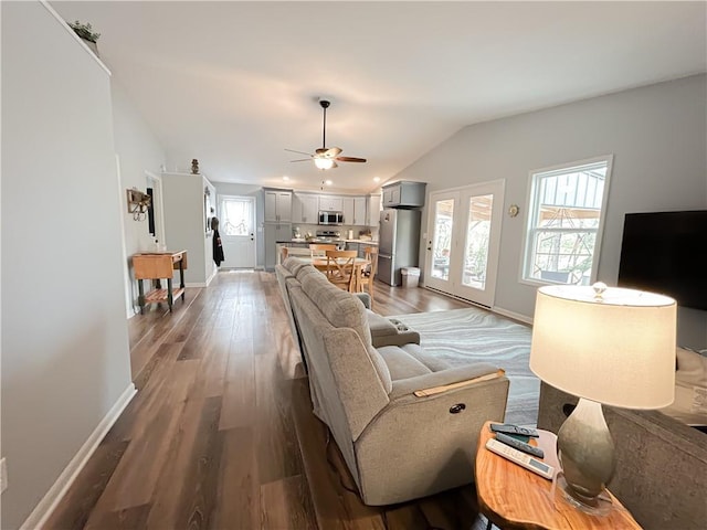 58 E Sugar Lake Cv, Mound City, KS 66056 - living area with baseboards, ceiling fan, and vaulted ceiling