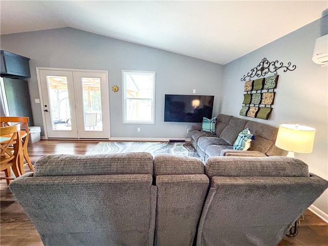 58 E Sugar Lake Cv, Mound City, KS 66056 - living room with wood finished floors, a wall mounted air conditioner, and vaulted ceiling