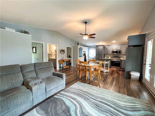 58 E Sugar Lake Cv, Mound City, KS 66056 - living room featuring dark wood-style floors, a ceiling fan, and vaulted ceiling