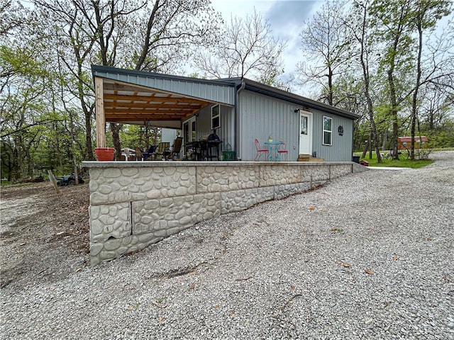 58 E Sugar Lake Cv, Mound City, KS 66056 - view of outbuilding featuring gravel driveway