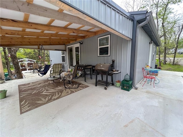 58 E Sugar Lake Cv, Mound City, KS 66056 - view of patio / terrace featuring outdoor dining space and area for grilling