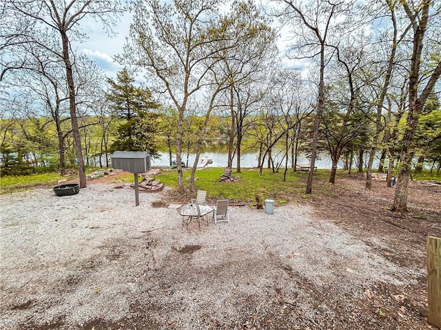 58 E Sugar Lake Cv, Mound City, KS 66056 - view of yard with a water view