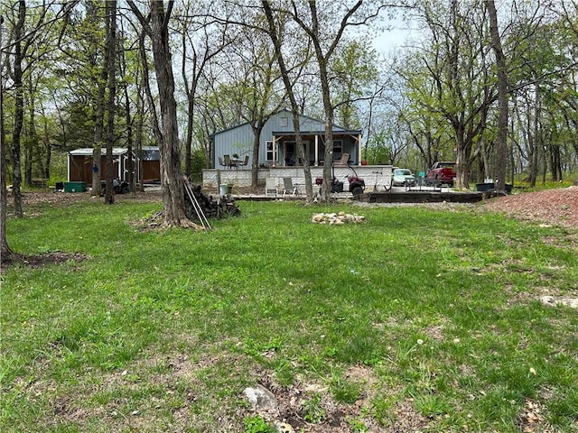 58 E Sugar Lake Cv, Mound City, KS 66056 - view of yard with an outbuilding