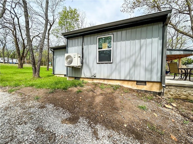 58 E Sugar Lake Cv, Mound City, KS 66056 - view of side of property with crawl space and ac unit