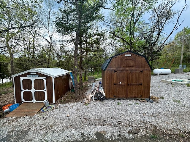 58 E Sugar Lake Cv, Mound City, KS 66056 - view of shed with central AC unit