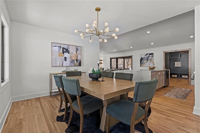 dining space featuring recessed lighting, baseboards, a chandelier, and light wood-style floors