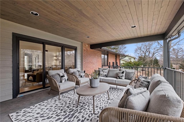 view of patio with an outdoor living space and a balcony