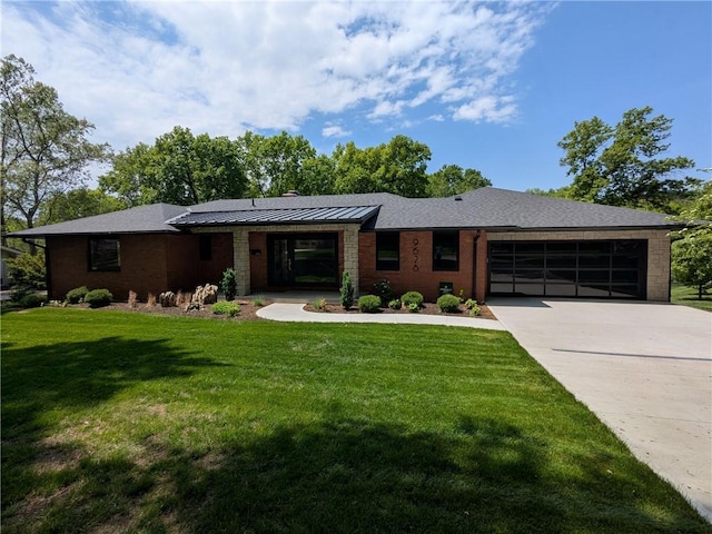 9628 Meadow Ln, Leawood, KS 66206 - view of front of house featuring a garage, concrete driveway, a front yard, a standing seam roof, and brick siding